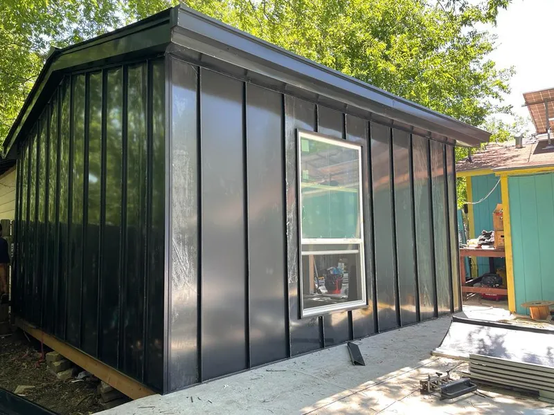 Black standing seam metal wall panels for Roof Inspection in Carson