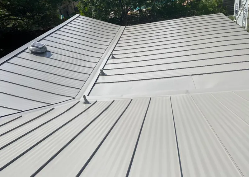 Solar attic fan installed on a metal roof for Roof Ventilation in Carson